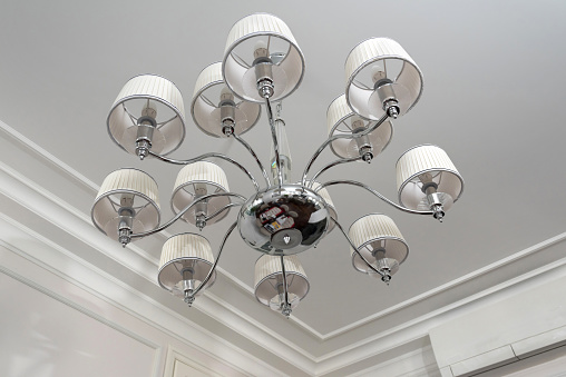 Ceiling mounted light fixture with white walls