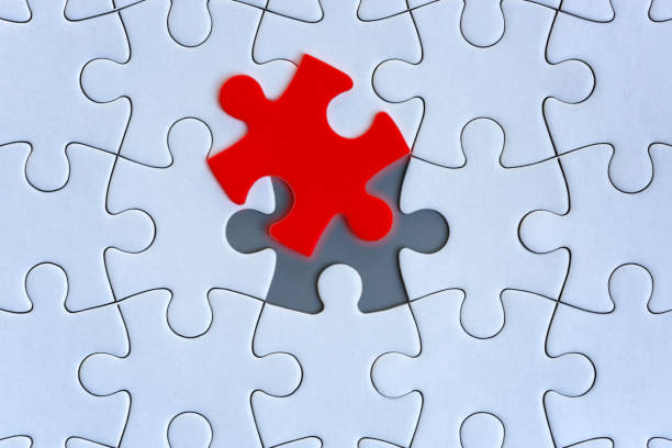 istock White jigsaw puzzle pieces on gray background 1267180434