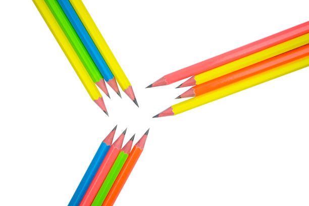 Pattern made with twelve different colored wood pencil crayons on white paper background