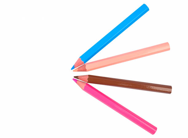 istock A pattern made with four different colored wood pencil crayons on white paper background 1267180636