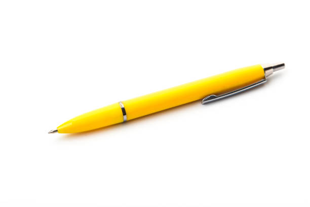 A green notepad a yellow fountain pen isolated on white background.