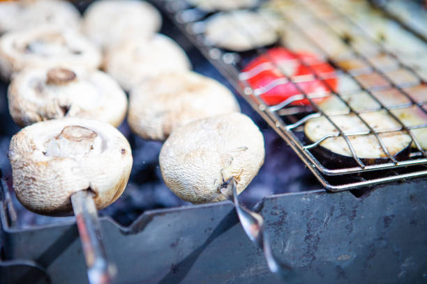 istock bbq concept fish on fire with mushroom and tomatoes 1267182947