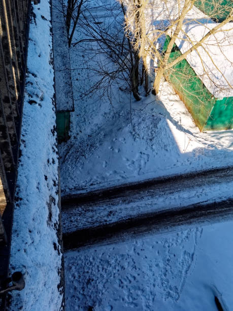 istock the road between the iron garage in the winter 1267182961