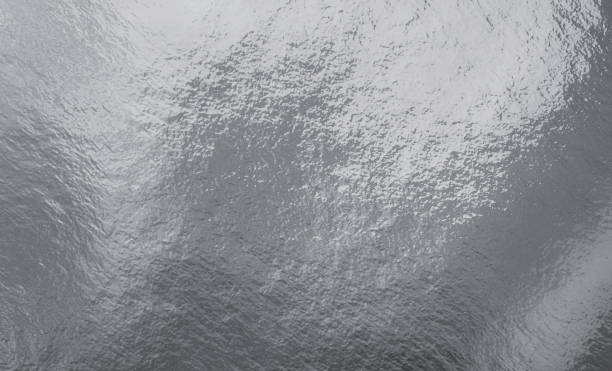 istock Silver foil texture background with highlights and uneven surface 1267185142