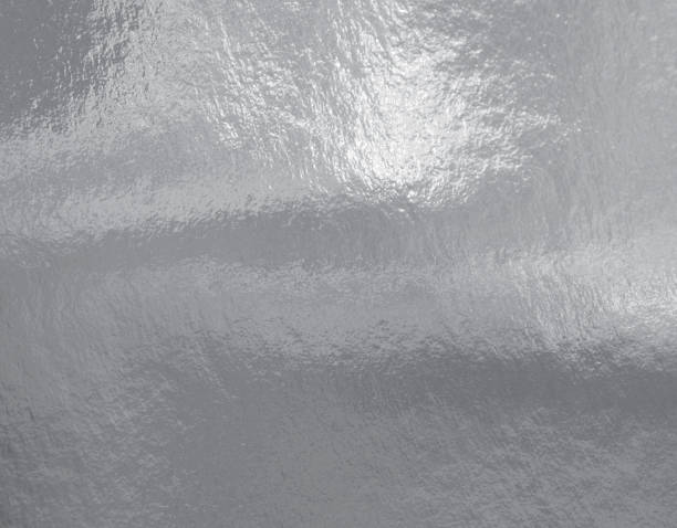 istock Silver foil texture background with highlights and uneven surface 1267185144