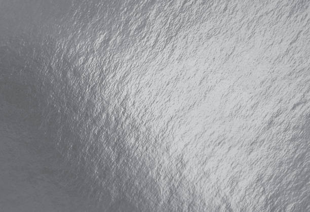 istock Silver foil texture background with highlights and uneven surface 1267185157