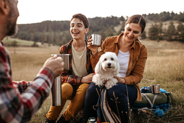 istock Family drinking coffee on hiking tour break 1267185159