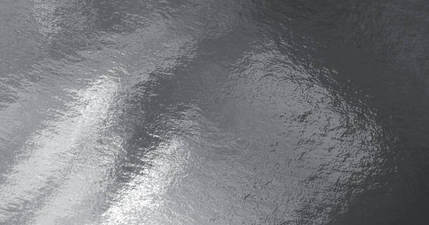 istock Silver foil texture background with highlights and uneven surface 1267185184