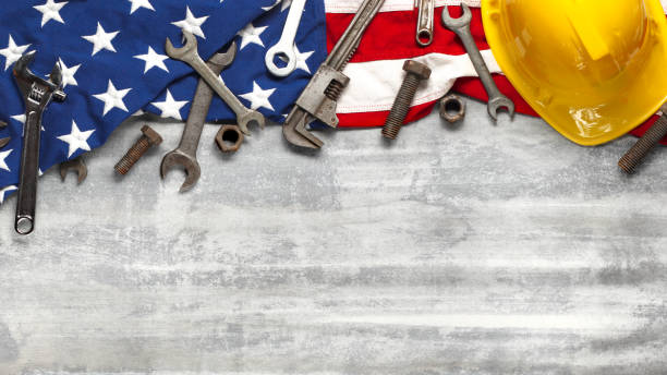 istock Labor day or American labor concept with construction and manufacturing tools on patriotic US, USA, American flag on white wooden background 1267185768