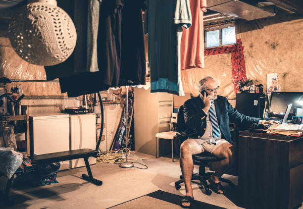 Mature man at work in his basement office