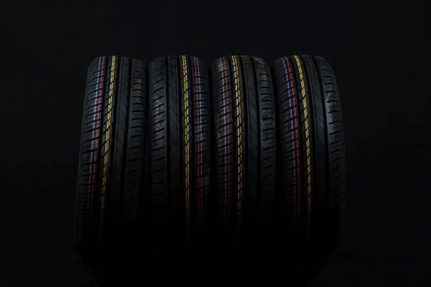 istock Car tires on a black background. 1267187529