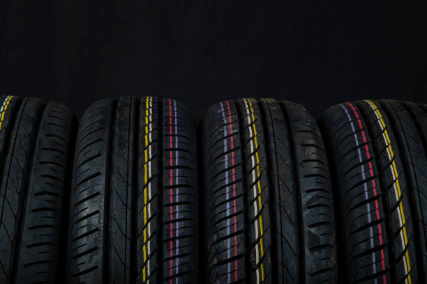 istock Car tires on a black background. 1267187548
