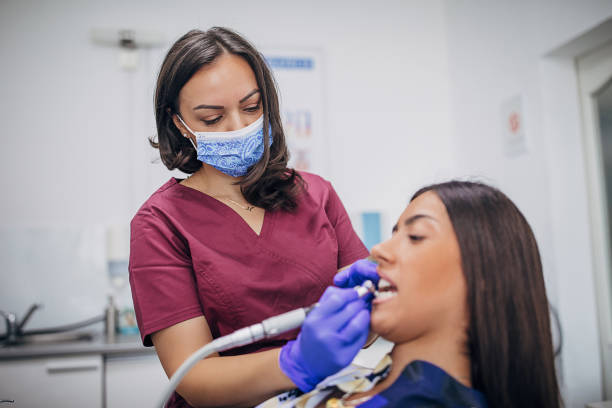 istock Young woman at the dentist getting her teeth treated 1267189419