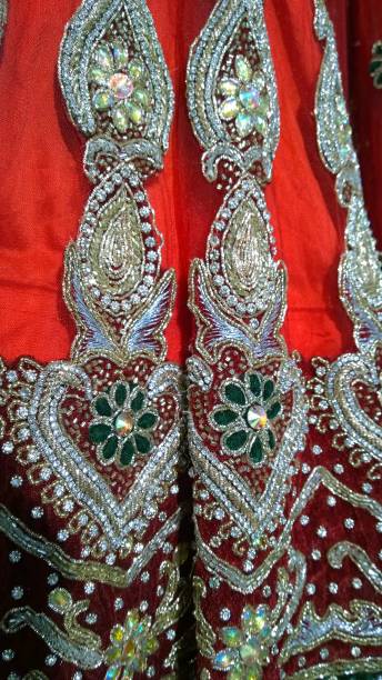 istock Handmade embroidery with beads, precious stones, expensive gold threads on red fabric. Element of Indian Traditional National textile. Art, party dresses and decorations. Glitte gems and diamonds 1267190448