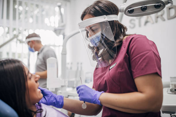 istock People at the dentist getting their teeth treated 1267190803