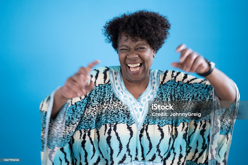 Informal Portrait Of Playful Early 60s Black Woman In Caftan Stock Photo -  Download Image Now - iStock