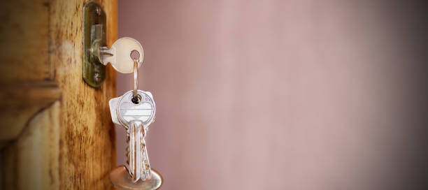 istock keys on vintage wooden door with space 1267196228