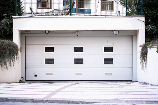 it's a garage door / nothing less and nothing more / than a garage door