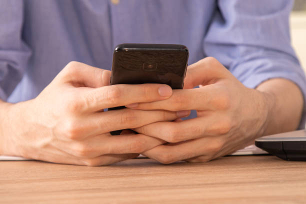 istock closeup of hands with mobile phone 1267196684