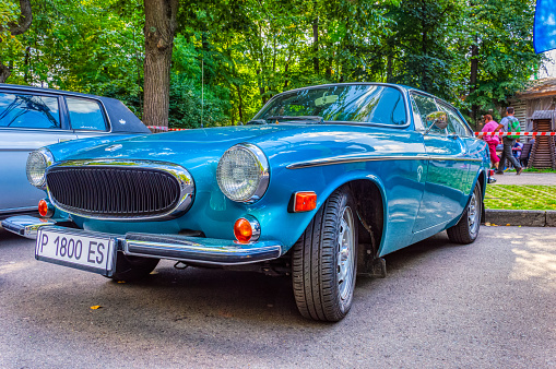 Exhibition of vintage cars and motorcycles in Sokolniki Park . Retro car show exhibion in Sokolniki park. Volvo P1800 old classic car. Moscow, Russia, August 2019