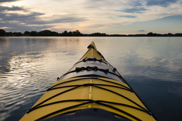 yellow kayak on small Ploner lake, river Schwentine, germany