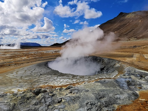 A view of the geothermal area at Hverir in Iceland which has boiling mud pools and Steaming fumaroles