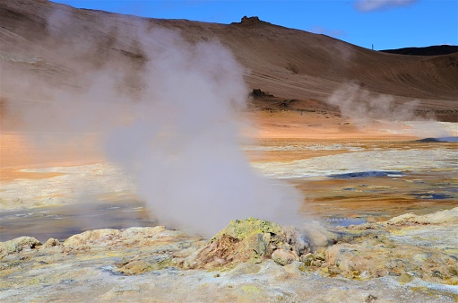 A view of the geothermal area at Hverir in Iceland which has boiling mud pools and Steaming fumaroles