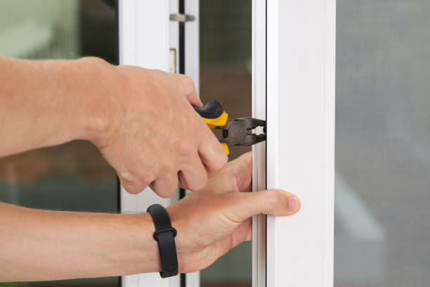 istock handyman adjusting white pvc plastic window indoors. worker using screwdriver to repair upvc window. homework maintenance 1267204354