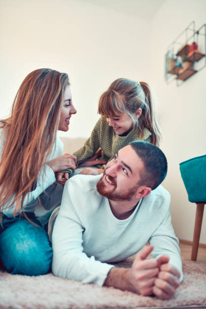 istock Family Relaxing On The Floor 1267207085
