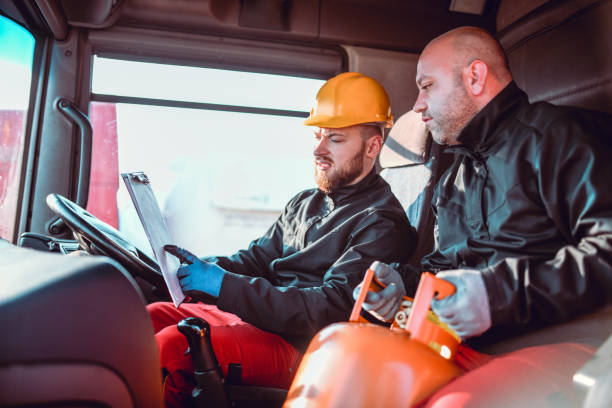 istock Tanker Truckers Checking Delivery Schedule 1267208326