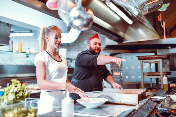 istock Chef Pointing Female To Check Sauce 1267209577