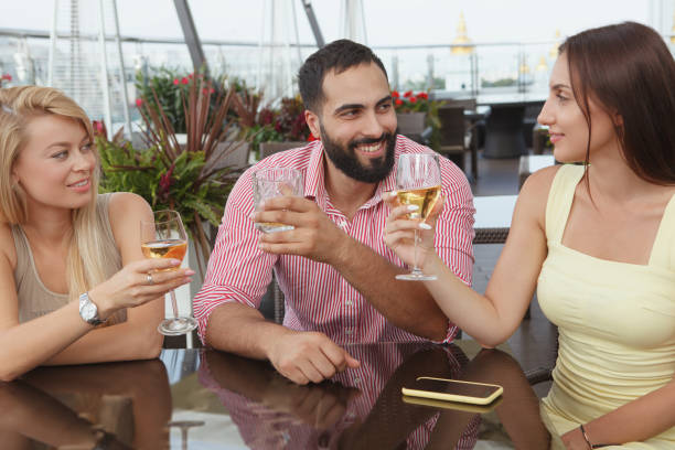 istock Friends drinking at rooftop bar 1267210744