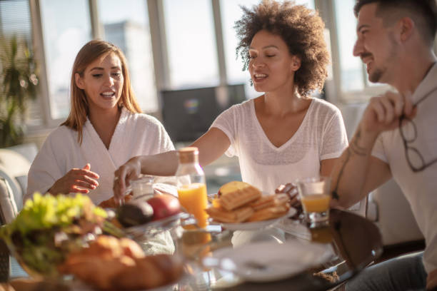 istock Group of multiethnic friends doing breakfast 1267211649