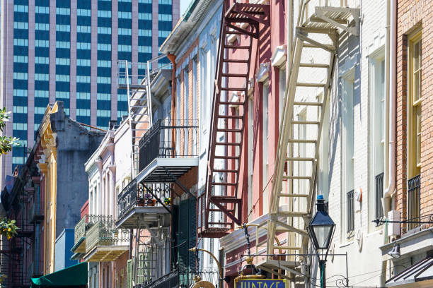 New Orleans - 04/15/2018 : retro buildings with fire escape stairs in the French Quarter
