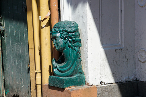 Door knocker in the shape of an Indian (?) on a pink coloured door. In Malta, such door knockers can be found on numerous doors in many different forms