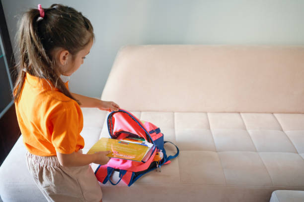 693 Girl Packing School Bag Stock Photos, High-Res Pictures, and