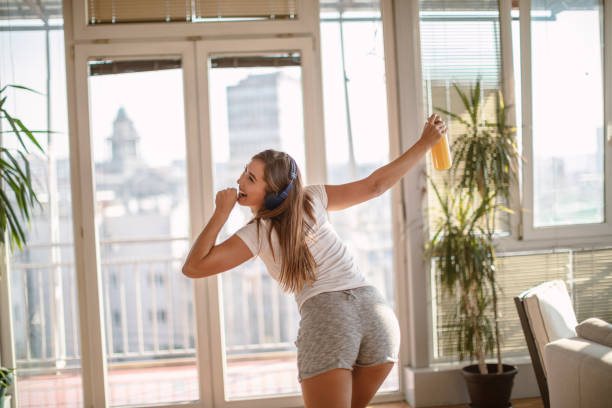 istock Woman dancing at home 1267215072
