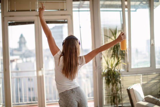 istock Woman dancing at home 1267215099