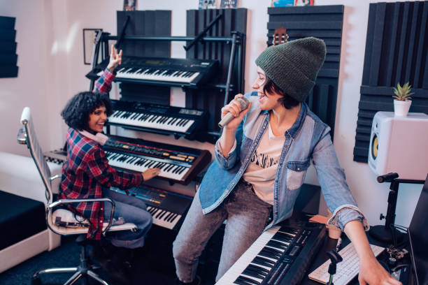 istock Two musicians recording music and having fun in their studio 1267215178