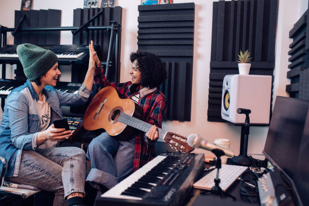 istock Girls from a music group successfully cooperating while making a new song 1267215186