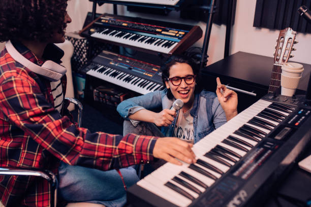 istock Two musicians having a great time while recording a new song 1267215191