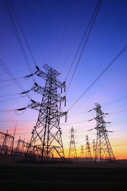 istock Pylons, high voltage pylons in the evening 1267216119