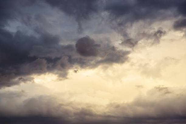 istock Beautiful evening cloudy sky. Gray sky with warm light 1267216166