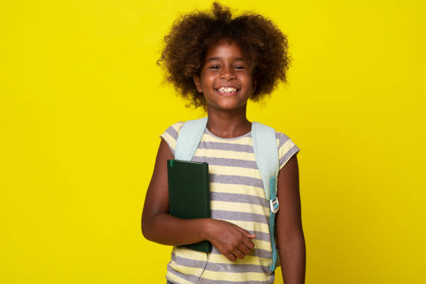 istock Portrait of a school girl with notebook and backpack 1267218087