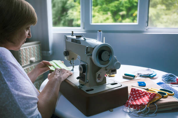 istock Woman sewing homemade protective face mask 1267219631