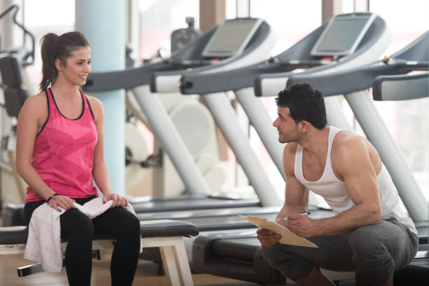istock Trainer Takes Notes While Woman Sitting and Resting 1267220790