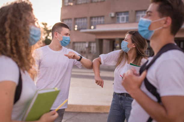 istock Students during pandemic / COVID-19 / Back to school / Handshake Alternatives 1267224579