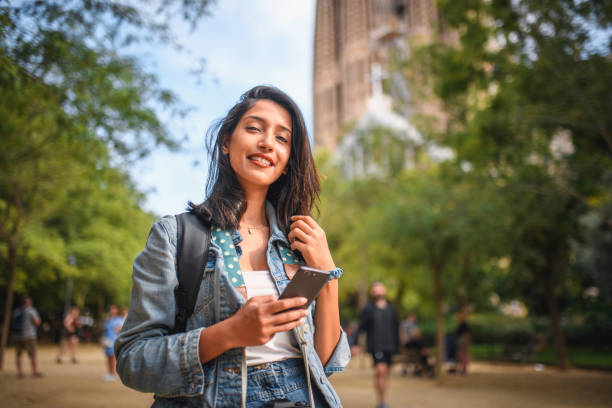 istock Independent Female Vacationer Using Smart Phone in Barcelona 1267228454