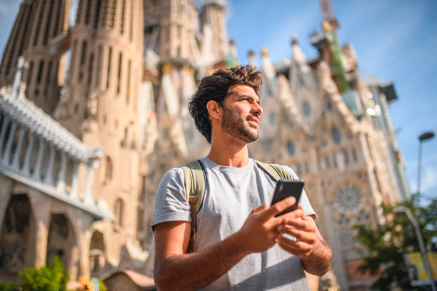 istock Male Tourist Using Smart Phone for Directions in Barcelona 1267228457