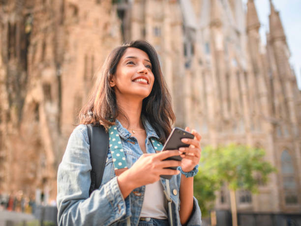 istock Young Female Sightseer with Smart Phone in Barcelona 1267228459
